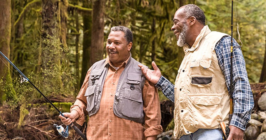 Two men talking while fishing