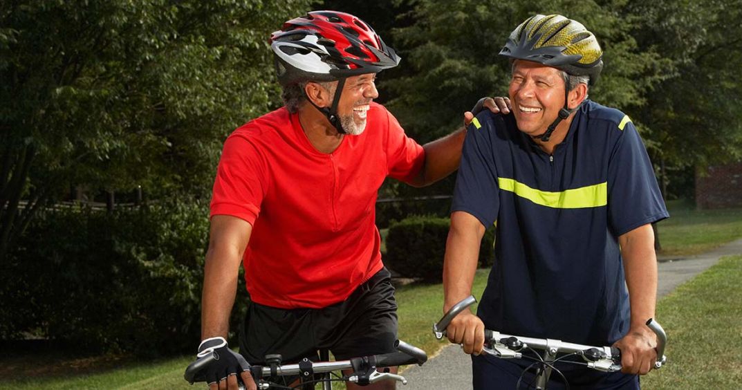 Two bike buddies laughing 