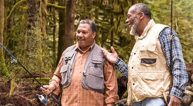 Two men talking while fishing